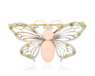 240 An Antique, Platinum Topped-Gold, Coral and Demantoid Garnet Brooch Of a butterfly design centering an oval and round coral cabochons, with accents of rose-cut diamonds and round demantoid garnets Measures: 2 x 1 in. 13.7 grams gross Estimate: $3,500 - $5,500