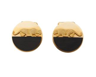 211 Gallen Benson: A Pair of 18K Gold and Wood Cufflinks Of a circular design featuring half round wooden elements topped with a gold panther motif, signed Gallen Benson 2 pieces Measures: 1 1/4 x 1 1/4 in. 27.6 grams gross This lot is offered at no reserve. Estimate: $1,500 - $2,000