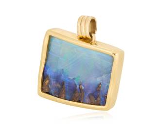 76 A 14K Gold and Boulder Opal Pendant Of an organic design centering a boulder opal measuring approximately 37.00 x 30.00 mm, signed with maker's mark W Measures: 1 1/2 x 1 1/4 in. 37.6 grams gross approximately 1.5" x 1.25" Estimate: $2,000 - $3,000