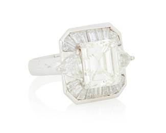295 An 18K White Gold and Diamond Ring Centering an emerald-cut diamond weighing 4.17 carats, accented by trilliant-cut and tapered baguette diamonds weighing approximately 1.50 carats Size: 4 1/2 8.7 grams gross Accompanied by a GIA Report numbered #2111820684, dated November 19, 2012, stating the diamond as Natural with a color grade of K and a clarity grade of VS1, no fluorescence. Estimate: $20,000 - $30,000