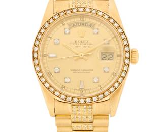 310 Rolex: An 18K Gold and Diamond 'Oyster Perpetual Day-Date' Watch Dial: 28.00 mm, round with baton hour markers encircled by round diamonds Case: 35.00 mm Case number: R676420, 3155 Closure: gold link bracelet set with round diamonds with deployment clasp Signed: dial, case and clasp, c. 1987, with original box and papers Inner circumference: 7 1/2 in. 136.3 grams gross Estimate: $12,000 - $18,000