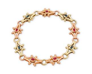 217 A 14K Bi-Color Gold and Gem-Set Bracelet Featuring fancy alternating links of rose and yellow gold, accented by oval rubies and sapphires, signed MK with Russian assay marks Length: 9 in. 27.0 grams gross Estimate: $3,500 - $5,500