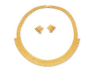 25 A Gold Necklace and Earring Set Of a fringe design featuring textured and high polish alternating links 3 pieces Necklace: 15 in., Earrings: 1/2 in. 61.2 grams gross Estimate: $4,500 - $5,500