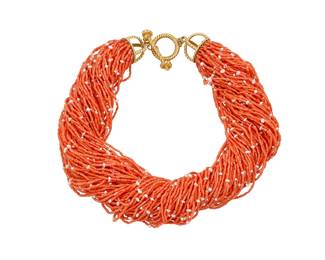 9 Mish NY: An 18K Gold and Coral Torsade Featuring eighty-eight strands of cylindrical coral and freshwater pearl beads, finished with a twisted gold toggle clasp, signed Mish NY Length: 18 in. 222.1 grams gross Estimate: $4,500 - $6,500
