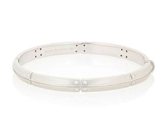 41 Tiffany: An 18K White Gold and Diamond 'Streameric' Bracelet Of a hinged design featuring satin finish segments, accented by twenty-four round diamonds, signed Tiffany & Co., 2000 Inner circumference: 6 3/4 in. 33.8 grams gross Estimate: $4,500 - $6,500