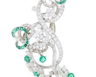 248 A Platinum, Emerald and Diamond Pin Of a swirling design with floral motifs, accented by round and tapered baguette diamonds, finished with round, old European-cut, baguette and marquise-shaped diamonds weighing approximately 10.20 carats Measures: 3 x 1 3/4 in. 39.1 grams gross Estimate: $5,000 - $7,000