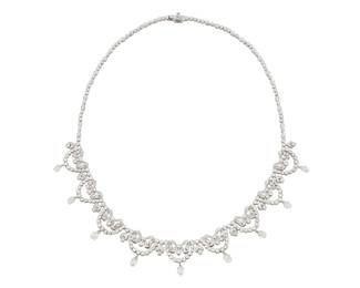 228 An 18K White Gold and Diamond Necklace Of a garland design featuring bow and scalloped motifs set round and briolette diamonds weighing approximately 9.45 carats Length: 16 in. 35.7 grams gross Estimate: $6,000 - $8,000