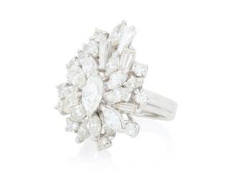 291 An 18K White Gold and Diamond Ring Of a cluster design featuring marquise-shaped, tapered baguette and round diamonds weighing approximately 2.90 carats Size: 4 1/2 9.5 grams gross Estimate: $2,500 - $3,500