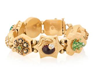 274 A 14K Gold, Gem-Set and Diamond Slide Bracelet Featuring nine slide links with snake, ladybug, frog and floral motifs accented by gemstones, diamonds and enamel Length: 7 3/4 in. Width: 3/4 in. 70.0 grams gross Estimate: $4,000 - $6,000