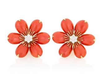 33 A Pair of 18K Gold, Coral and Diamond Earrings Of a floral design featuring pear-shaped coral cabochon petals, centering fourteen round diamonds weighing approximately, with Italians workshop marks 2 pieces Measures: 1 1/2 x 1 1/2 in. 33.1 grams gross Estimate: $5,500 - $7,500