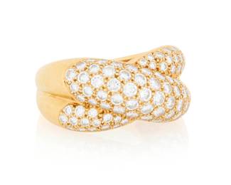 134 Cartier: An 18K Gold and Diamond 'Colisee' Ring Of a crossover design set with graduated round diamonds weighing approximately 0.96 carat, signed Catier, 52, 1995 Size: 6 10.7 grams gross Estimate: $6,000 - $8,000