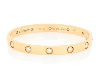 5 Cartier: An 18K Gold and Diamond 'Love' Bracelet Of a high polish design featuring ten round diamonds weighing approximately 1.00 carat, signed Cartier, 17, WW, no.4344 Inner Circumference: 6 1/4 in. 29.8 grams gross Estimate: $4,500 - $6,500
