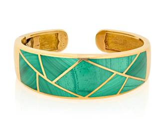 81 Bulgari: An 18K Gold and Malachite Cuff Featuring trapezoidal malachite inlay, signed Bulgari, H17, with Italian workshop marks Measures: 6 1/2 in., Gap: 5/8 in. 56.5 grams gross Estimate: $9,000 - $12,000