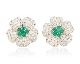 225 A Pair of 18K White Gold, Emerald and Diamond Earrings Of a floral design, centering round emeralds, with petals accented by round diamonds weighing approximately 4.80 carats 2 pieces Measures: 1 x 1 in. 27.7 grams gross Estimate: $4,500 - $6,500