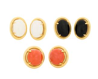 79 Gumps: Three Pairs of 18K Gold and Hardstone Earrings Centering oval and round cabochons of coral, black onyx, and white jade, set in high polish gold frames, signed Gumps 6 pieces Measures: 7/8 x 7/8 in., 1 x 3/4 in. and 7/8 x 5/8 in. 65.7 grams gross Estimate: $3,000 - $5,000
