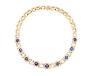 156 An 18K Gold, Sapphire, and Diamond Necklace Centering nine oval sapphires weighing approximately 18.00 carats total, accented by round and channel-set diamonds weighing approximately 10.50 carats, set in an open link design Length: 16 in. 87.9 grams gross Estimate: $20,000 - $30,000