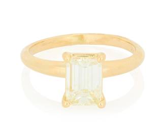 289 A 14K Gold and Diamond Ring Centering a solitaire emerald-cut diamond weighing approximately 1.40 carats Size: 6 3/4 3.0 grams gross Estimate: $1,800 - $2,500