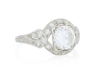 181 A Platinum and Diamond Ring Centering and old European-cut diamond weighing approximately 1.38 carats, accented by single-cut diamonds Size: 7 1/2 3.6 grams gross Estimate: $2,500 - $3,500