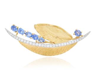 198 An 18K Gold, Platinum, Sapphire, and Diamond Brooch Of a foliate design featuring textured yellow gold leaves and a central stem of platinum set with round diamonds weighing approximately 3.60 carats, accented by size oval sapphires Measures: 3 x 1 in. 21.6 grams gross Estimate: $2,500 - $3,500