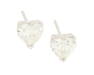 193 A Pair of 14K White Gold and Diamond Studs Centering two heart-shaped diamonds weighing approximately 1.01 and 1.02 carats 2 pieces Measures: 1/4 in. 1.6 grams gross Estimate: $2,500 - $3,500