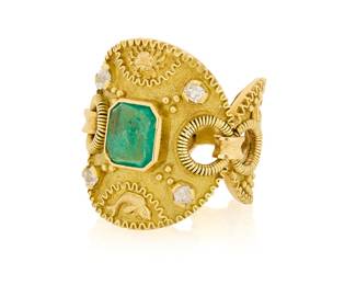 24 An 18K Gold Emerald and Diamond Zodiac Ring Featuring motifs of a scorpion, crab, fish and ram, accented by gold granulation and four old mine diamonds, centering an octagonal emerald measuring approximately 8.04 x 7.07 x 2.05 mm Size: 7 3/4 in. 12.6 grams gross Estimate: $1,500 - $2,500