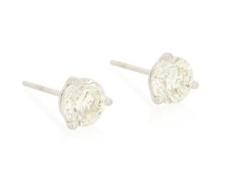 290 A Pair of 14K Gold and Diamond Stud Earrings Centering two round diamonds weighing approximately 1.02 and 1.05 carats 2 pieces Measures: 1/4 in. 1.4 grams gross Estimate: $1,200 - $1,800