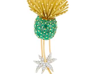 255 An 18K Gold, Platinum, Emerald and Diamond Brooch Of a thistle design accented by round emeralds, featuring leaves set with single-cut diamonds, with French assay marks Measures: 3 x 1 in. 35.2 grams gross Estimate: $4,500 - $6,500