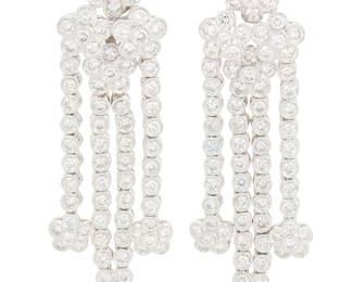 298 A Pair of 18K White Gold and Round Diamond Earrings Featuring floral motifs suspending cascading tendrils set with round diamonds weighing approximately 7.50 carats total Measures: 2 x 5/8 in. 20.9 grams gross Estimate: $5,500 - $7,500