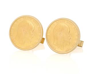 12 A Pair of Gold Coin Cufflinks Featuring two 22k gold British Sovereign coins, set in 14k gold frames 2 pieces Measures: 7/8 x 7/8 in. 23.7 grams gross Estimate: $1,500 - $2,500