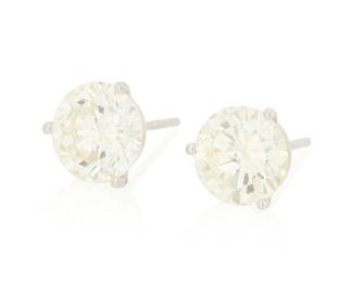 102 A Pair of 14K White Gold and Diamond Stud Earrings Centering two round diamonds weighing approximately 1.70 and 2.00 carats 2 pieces Measures: 3/8 in. 1.8 grams gross Estimate: $7,000 - $9,000