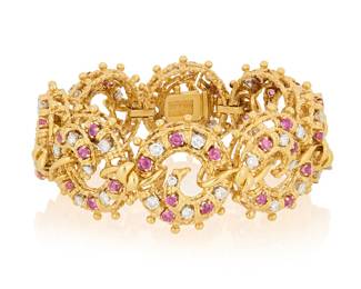 268 Tiffany & Co.: An 18K Gold and Diamond Bracelet Featuring nautical style links accented by round rubies, and round diamonds weighing approximately 4.32 carats, signed Tiffany Length: 6 1/4 in., Width: 1 in. 76.3 grams gross Estimate: $12,000 - $18,000