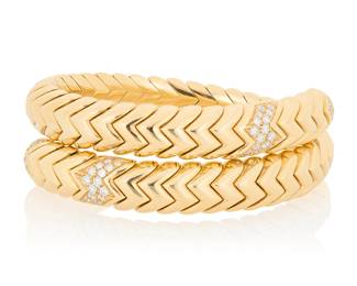 263 Bulgari: An 18K Gold and Diamond 'Spiga' Bracelet Of a flexible design featuring chevron motif links accented by round diamonds weighing approximately 0.90 carat, signed Bulgari with Italian workshop marks Measures: 5 3/4 - 6 1/2 in. 62.2 grams gross Estimate: $18,000 - $22,000