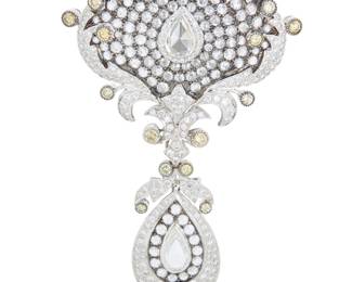 114 An 18K White Gold, Colored Diamond and Diamond Pendant/Brooch Of an ornate scrolling design featuring round and pear-shaped rose-cut diamonds accented by round near-colorless and colored diamonds weighing approximately 10.00 carats total, with a detachable pendant Measures: 3 1/2 x 2 in. 28.7 grams gross Estimate: $5,000 - $7,000
