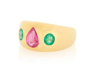 215 An 18K Gold, Ruby and Emerald Ring Centering a pear-shaped ruby flanked by two round emeralds in a gypsy-set design Size: 7 8.6 grams gross Estimate: $1,800 - $2,200