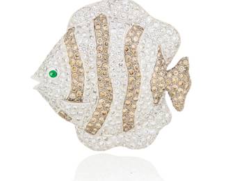 195 An 18K White Gold, Diamond and Emerald Brooch Of a tropical fish design featuring bands of round brown and near-colorless diamonds weighing approximately 6.50 carats, finished with a round emerald eye Measures: 1 5/8 x 1 5/8 in. 15.1 grams gross Estimate: $2,500 - $3,500
