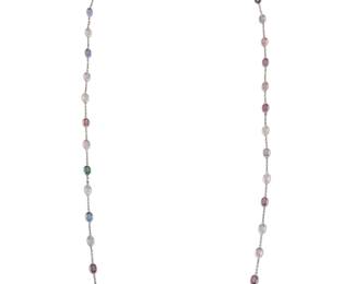 249 A Platinum and Colored Sapphire Long Chain Of a station design featuring oval blue, green, pink, purple and yellow sapphires weighing approximately 70.00 carats total Length: 38 in. 34.5 grams gross Estimate: $9,000 - $12,000