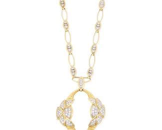 278 An 18K Bi-Color Gold and Diamond Pendant Necklace Featuring an open link chain suspending a foliate motif pendant all set with round and baguette diamonds weighing approximately 5.40 carats with French assay marks Chain: 24 in., Pendant: 2 1/2 x 1 7/8 in. 64.1 grams gross Estimate: $9,000 - $12,000