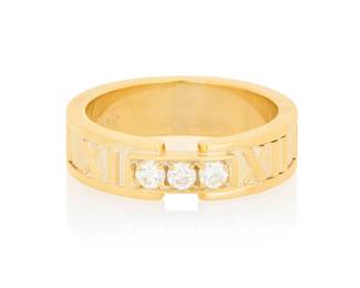 4 Tiffany & Co.: An 18K Gold and Diamond 'Atlas' Ring Featuring three round diamonds weighing approximately 0.15 carat, accented by high polish Roman numerals, signed Tiffany & Co. Size: 6 3/4 7.6 grams gross Estimate: $1,500 - $2,000