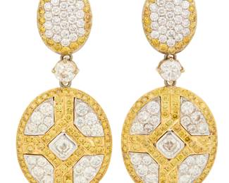262 A Pair of 18K Bi-Color Gold, Colored Diamond and Diamond Earrings Suspending oval frames centering two Asscher-cut diamonds, accented by round near-colorless and yellow diamonds weighing approximately 6.55 carats total 2 pieces Measures: 1 7/8 x 7/8 in. 17.8 grams gross Estimate: $6,000 - $8,000