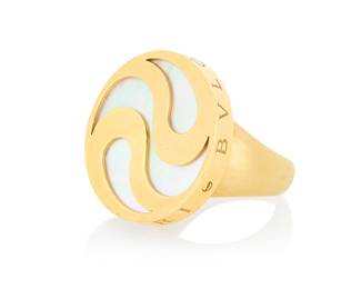 59 Bulgari: An 18K Gold, Stainless-Steel and Mother-of-Pearl Spinning Ring Featuring a round spinning top inlaid with mother-of-pearl accented by swirling bands of gold, signed Bulgari with Italian workshops marks Size: 6 24.3 grams gross Estimate: $3,500 - $5,500
