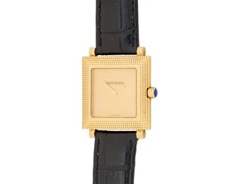 304 Boucheron: An 18K Gold Carre 'Clous de Paris' Watch Dial: 18.50 mm, square gold dial with no hour markers Case: 28.00 mm Case number: AJ 415022 Closure: black leather strap with and 18k gold buckle clasp Signed: dial, case, strap and clasp Inner circumference: 7 - 8 3/4 in. 49.7 grams gross Estimate: $5,000 - $7,000