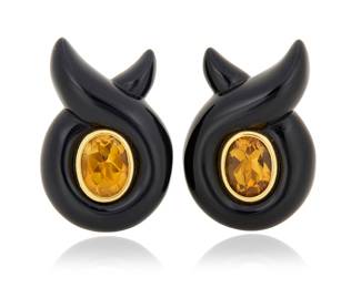 91 Verdura: A Pair of 18K Gold, Citrine and Onyx Earclips Featuring carved twisted onyx, centering two oval citrines, signed Verdura, 23286 2 pieces Measures: 1 x 3/4 in. 17.2 grams gross Estimate: $4,000 - $6,000