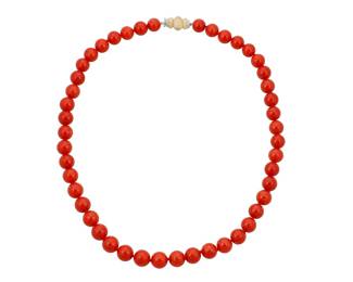34 Buccellati: An 18K Bi-Color Gold and Coral Necklace Of a single strand design featuring slightly graduated coral beads measuring approximately 9.20 - 9.90 mm, finished with a textured gold and diamond clasp, signed M. Buccellati Length: 19 in. 64.4 grams gross Estimate: $7,000 - $10,000