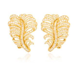 271 A Pair of 18K Gold and Diamond Earrings Of a feather design set with baguette and round diamonds weighing approximately 4.65 carats 2 pieces Measures: 1 3/8 x 1 in. 16.2 grams gross Estimate: $4,500 - $6,500