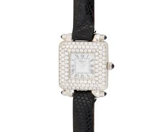 315 Chopard: An 18K White Gold and Diamond 'Happy Sport' Watch Dial: 11.70 mm, square with Roman numeral hour markers, accented by round diamonds Case: 21.50 mm Number: 976-001, 530482, 419-1 Closure: black leather strap with metal buckle clasp Signed: dial and case Inner circumference: 6 - 7 1/4 in. 29.8 grams gross Estimate: $4,000 - $6,000