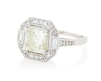 250 A 14K White Gold and Diamond Ring Centering a princess-cut diamond weighing approximately 2.00 carats, accented by round and baguette diamonds set in a geometric frame Size: 7 4.3 grams gross Estimate: $4,000 - $6,000
