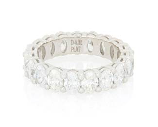 254 A Platinum and Diamond Eternity Ring Featuring nineteen oval diamonds weighing approximately 4.80 carats Size: 6 1/2 7.3 grams gross Estimate: $5,000 - $7,000