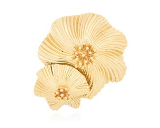 257 Cartier: A 14K Gold Brooch Featuring overlapping swirling burst designs, signed Cartier, c. 1940s Measures: 1 1/4 x 1 in. 15.4 grams gross Estimate: $3,000 - $5,000