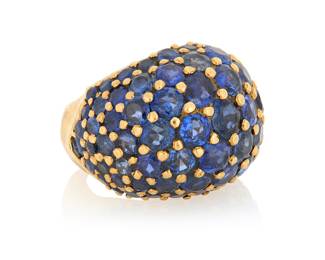 158 An 18K Gold and Sapphire Ring Of a bombe design set with graduated round sapphires, with French assay marks Size: 4 3/4 15.5 grams gross Estimate: $3,500 - $5,500