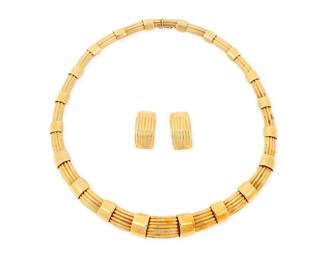 75 An 18K Gold Necklace and Earring Set Of a fancy articulated link design necklace, with two extra necklace links 5 pieces Necklace: 18 in., Earrings: 1 in. and Link: 1 in. 175.0 grams gross Estimate: $15,000 - $20,000